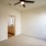 Large well lit bedroom with plush carpets and large windows 