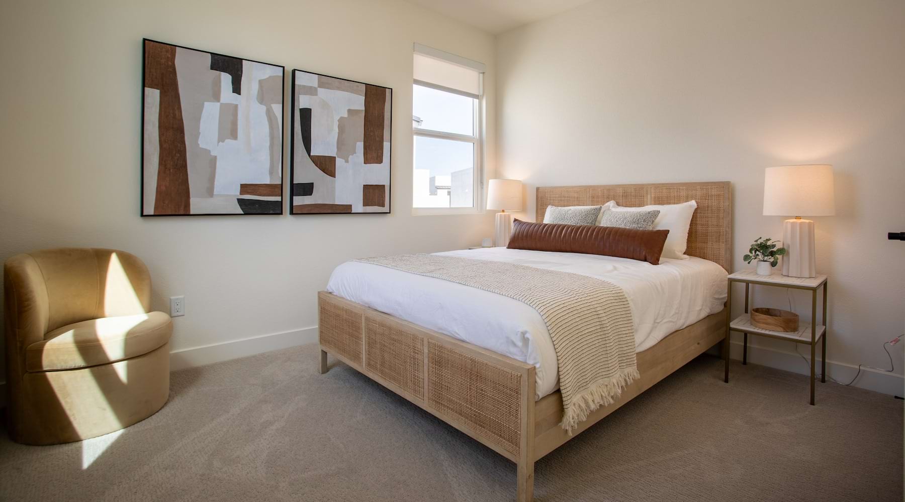 Bedroom Large well lit bedroom with carpeted floors and a large window