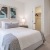 bedroom with nightstands on each side of the bed