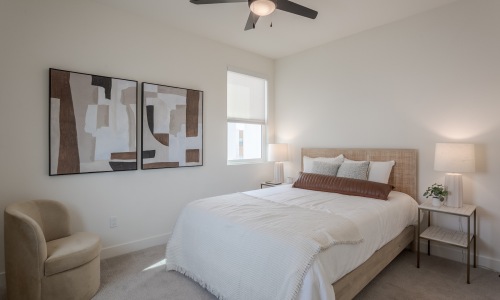 bedroom with a large bed, chair and window