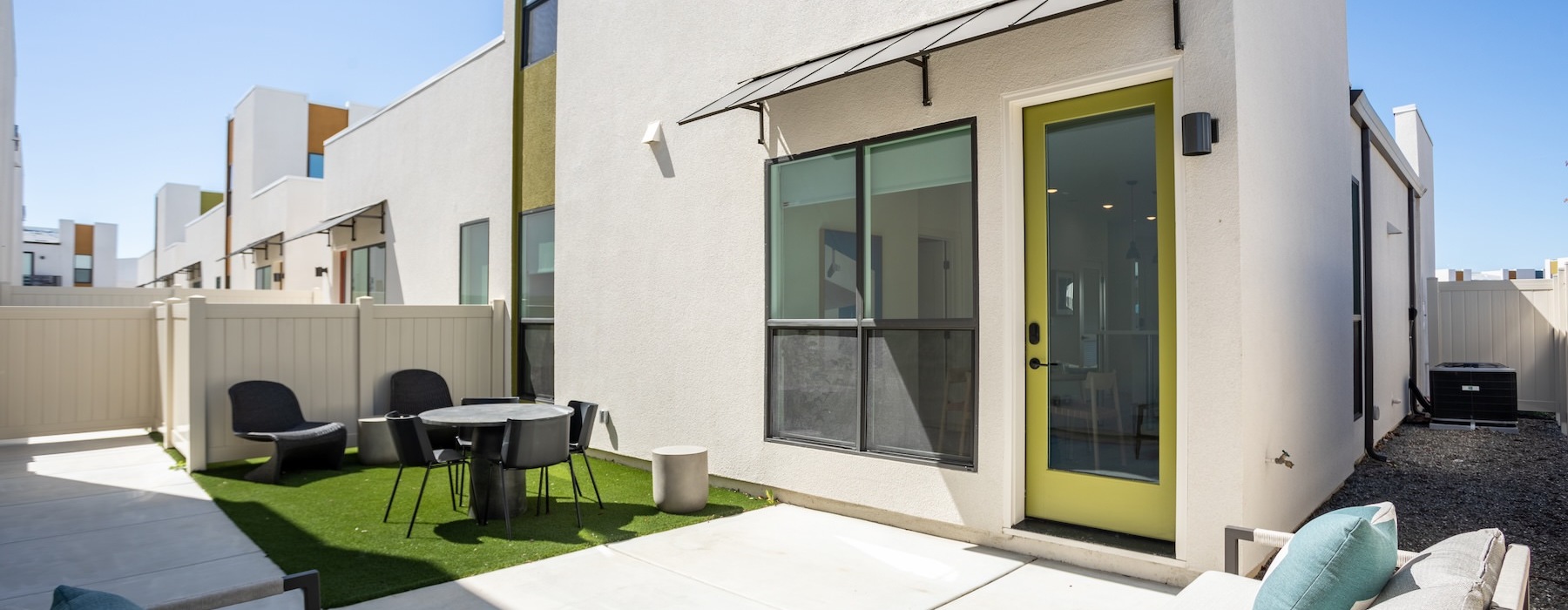 patio with a table, chairs and a couch