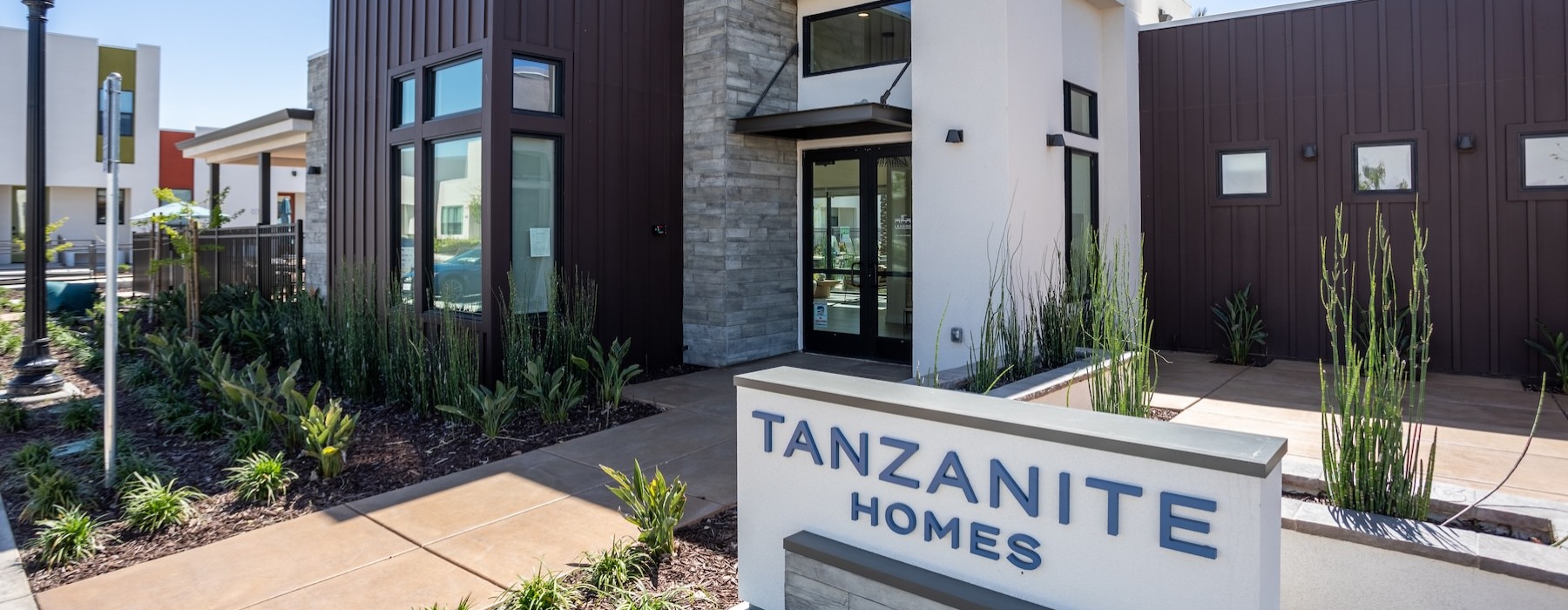 building entrance with a sign in front