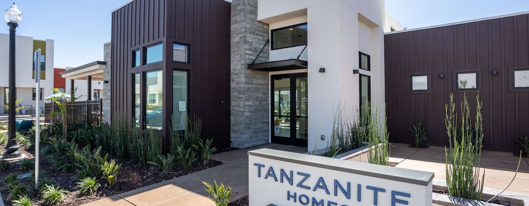 building entrance with a sign in front