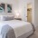 Pet-Friendly Houses In Natomas, CA - Tanzanite Homes - Spacious Bedroom With Plush Carpeting, Bed, Nightstands With Lamps, Large Closet, And Attached Bathroom.
