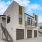 Two-Bedroom House in Natomas, CA - Tanzanite - Building Exterior with Garage Doors, Stair Access, Windows, and Balcony.